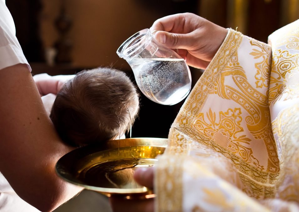 Infant,Baptism.,Water,Is,Poured,On,The,Head,Of,An Infant,Baptism.,Water,Is,Poured,On,The,Head,Of,An